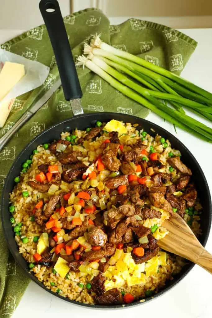 Return everything to the skillet over medium-low heat and stir to warm. Add the green onions and stir to combine. For best results sever promptly. 