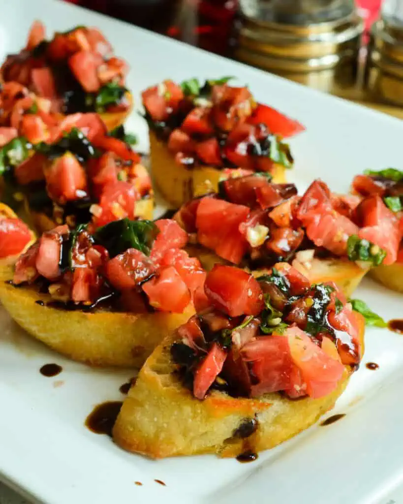 Sun ripened tomatoes, fresh garden basil, and sweet garlic combine to bring you summer's best in this easy Bruschetta recipe with a flavorful balsamic glaze. 