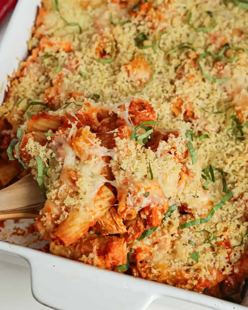 This Chicken Parmesan Casserole brings rotisserie chicken, marinara, Italian seasoning, Parmesan cheese, and mozzarella together, all sprinkled with a buttery Parmesan breadcrumb topping.