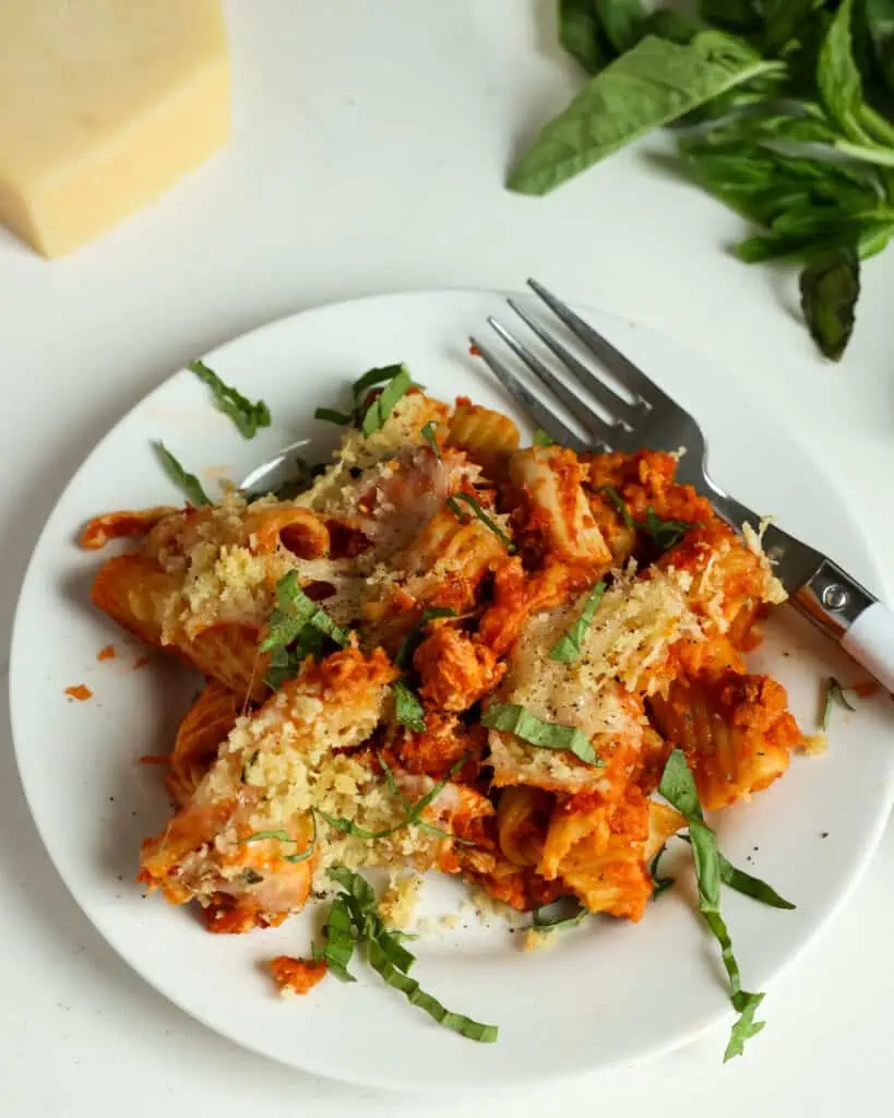 Chicken Parmesan Casserole brings cooked chicken, marinara, Italian seasoning, Parmesan cheese, and mozzarella cheese all sprinkled with a buttery Parmesan breadcrumb topping.