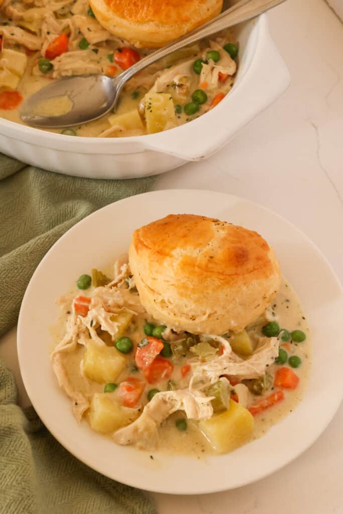 This comforting casserole features a creamy chicken and vegetable filling topped with buttery and flaky biscuits. The ultimate comfort food recipe.