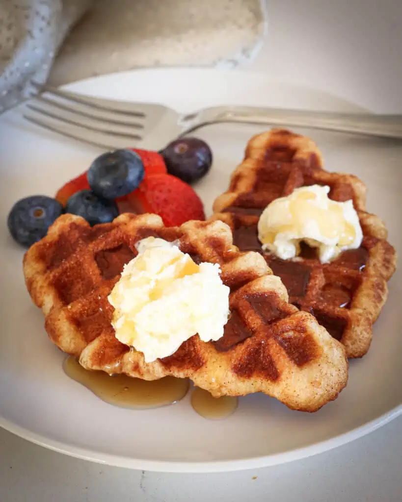 Refrigerated ready-made crescent rolls are rolled in cinnamon sugar and placed on a preheated waffle iron for just a couple of minutes or until golden brown.  