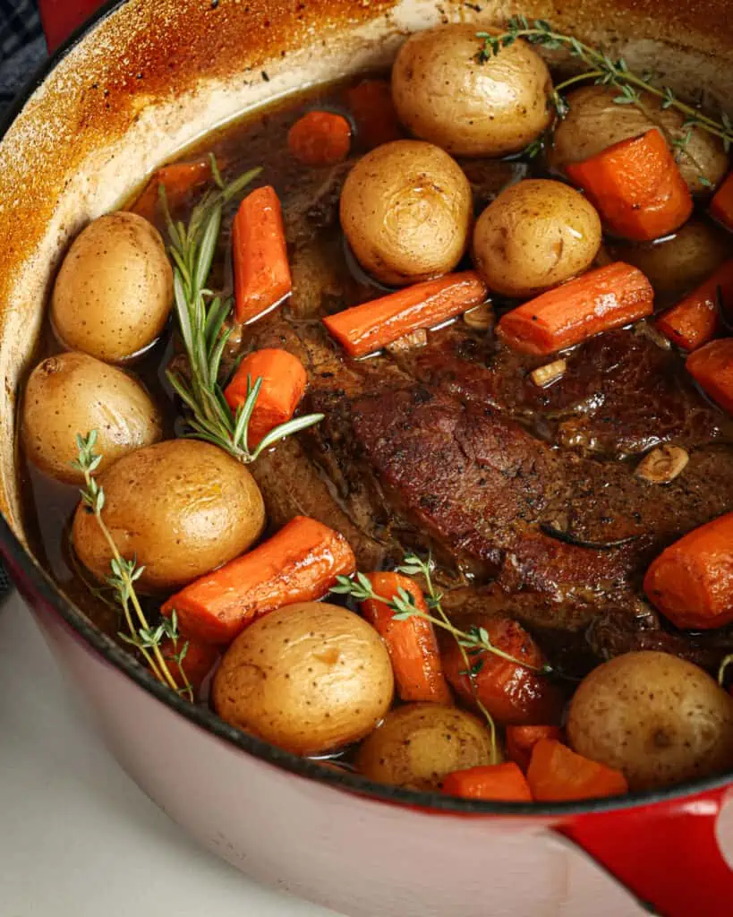 Warm up on a cold day with this delicious and easy Dutch oven pot roast recipe. Tender beef, flavorful vegetables, and a rich gravy make this the perfect comfort food meal.