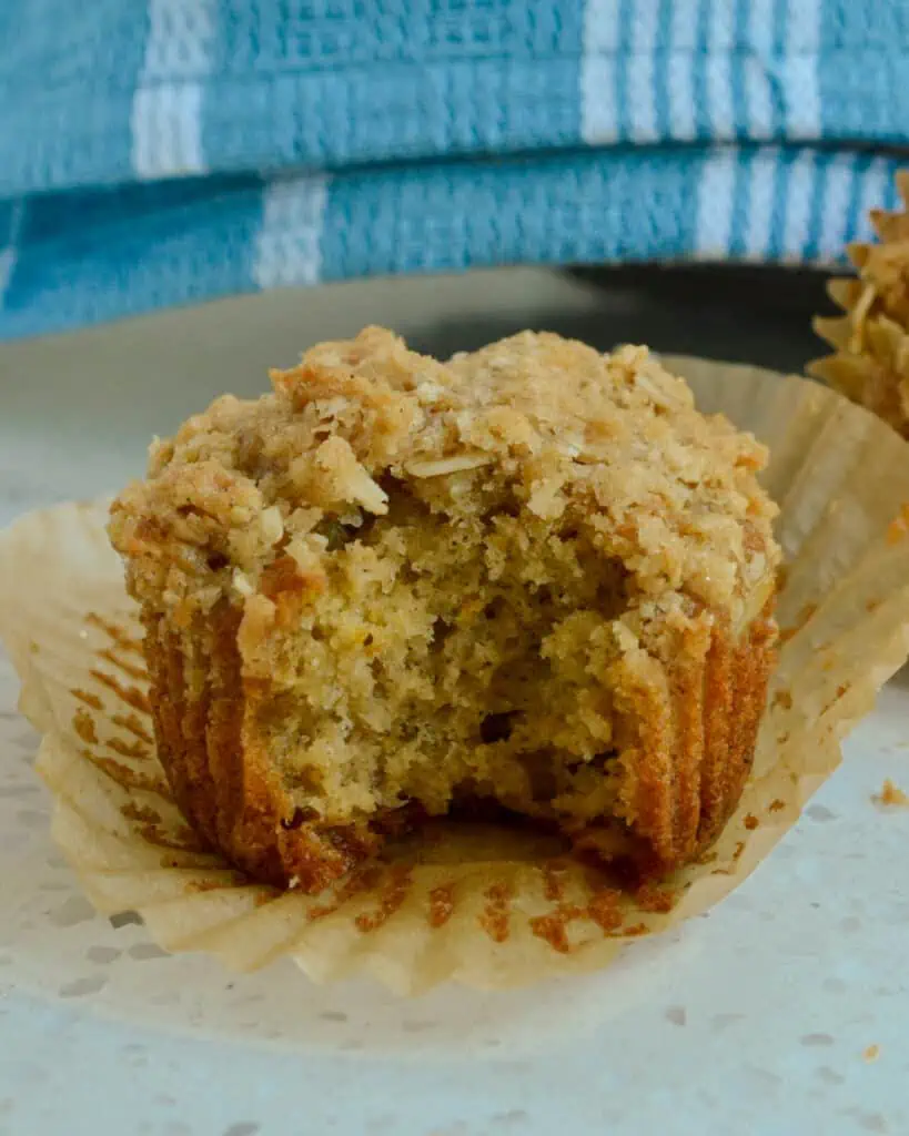 These quick, easy, and tasty Oatmeal Muffins with a touch of orange zest and cinnamon are topped with a five-ingredient crumble topping that takes it over the top.