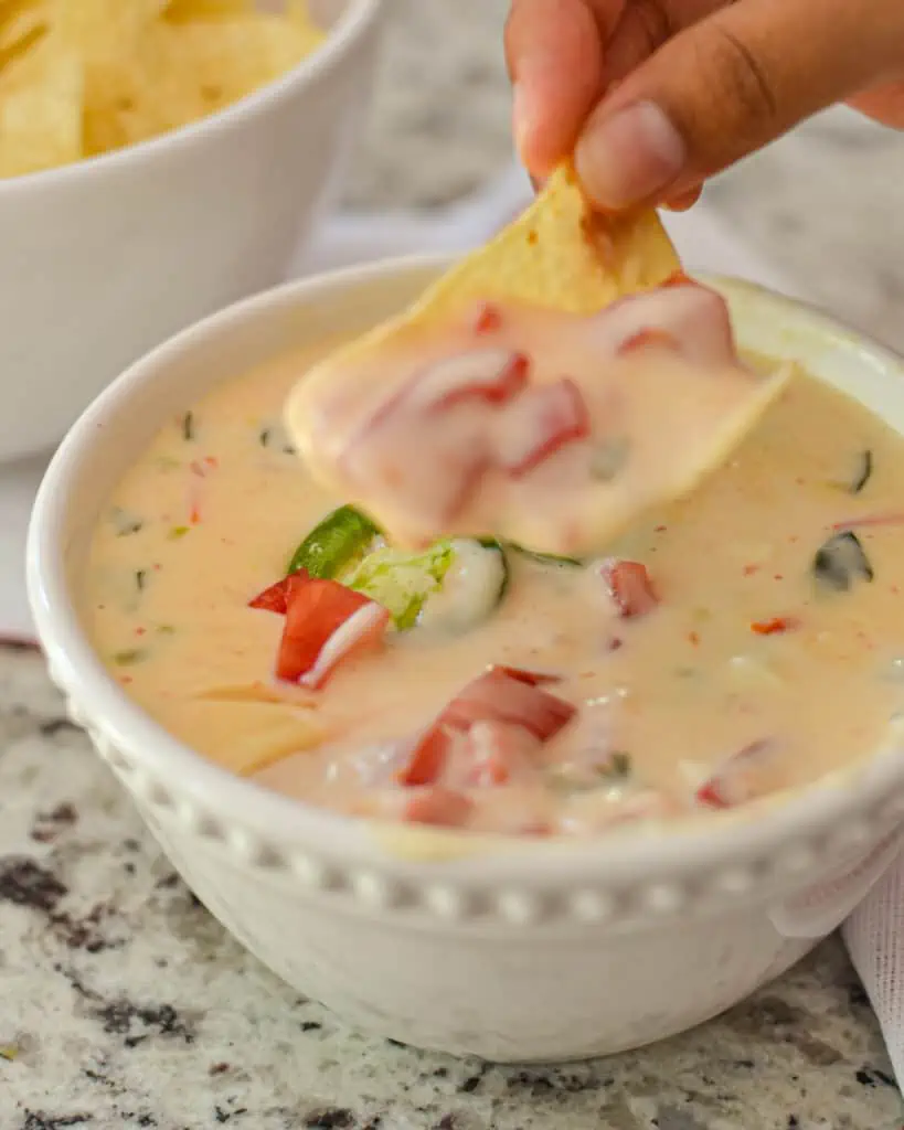 We love this easy white queso! Your imagination only limits the endless uses for this delicious dip, and it reheats so well multiple times.