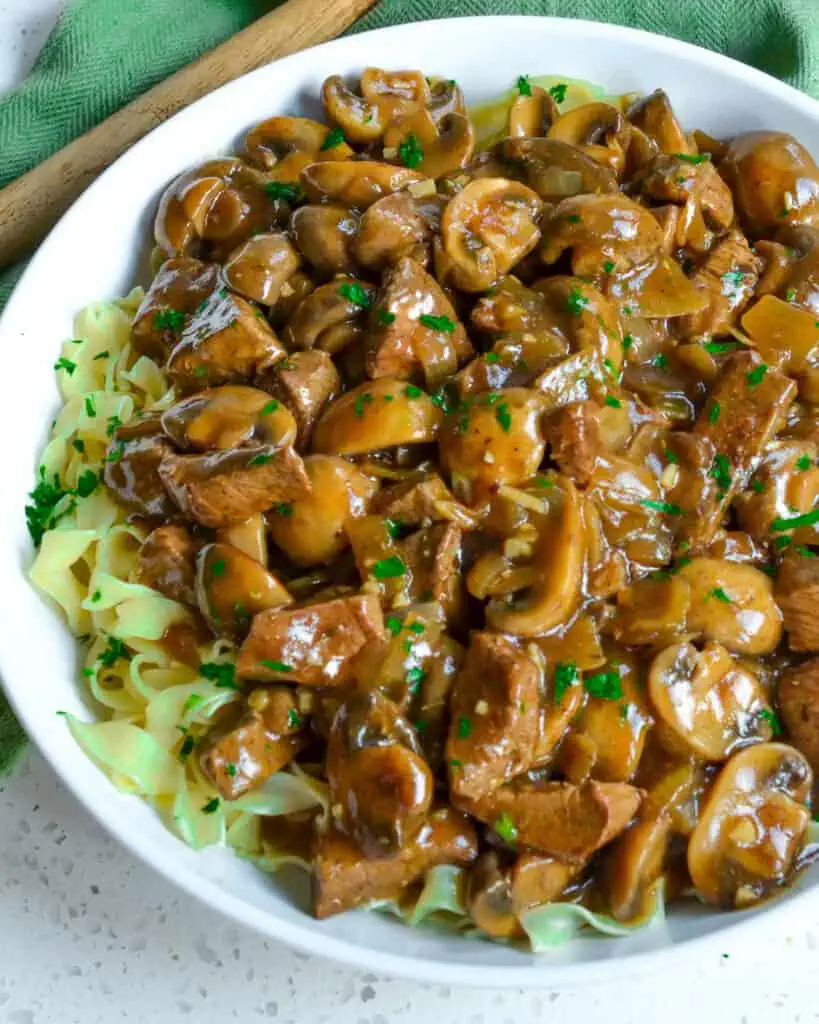 You will love this no-canned soup recipe with onions, garlic, and white button mushrooms smothered in an easy-to-make gravy.