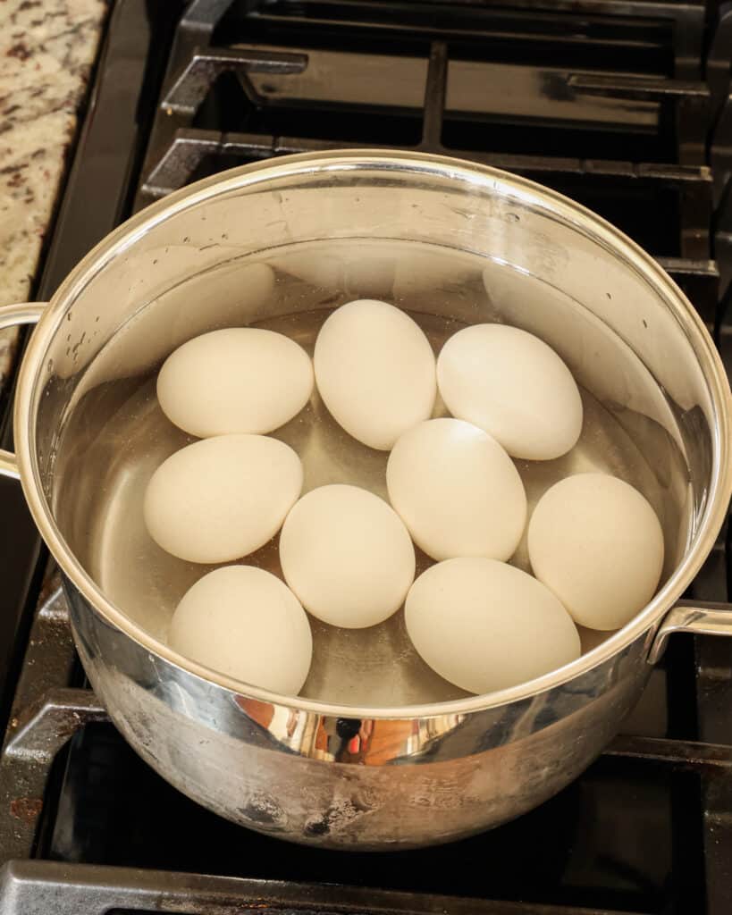 Add the eggs to a large pot without overcrowding. Fill the pot with cold water to an inch over the eggs,