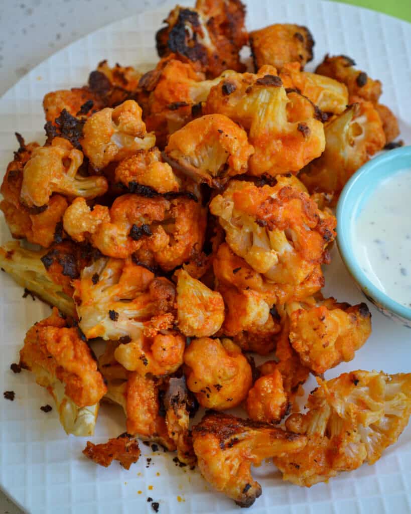 These delectable Buffalo Cauliflower bites are just as tasty as buffalo chicken with a lot less fat and calories.