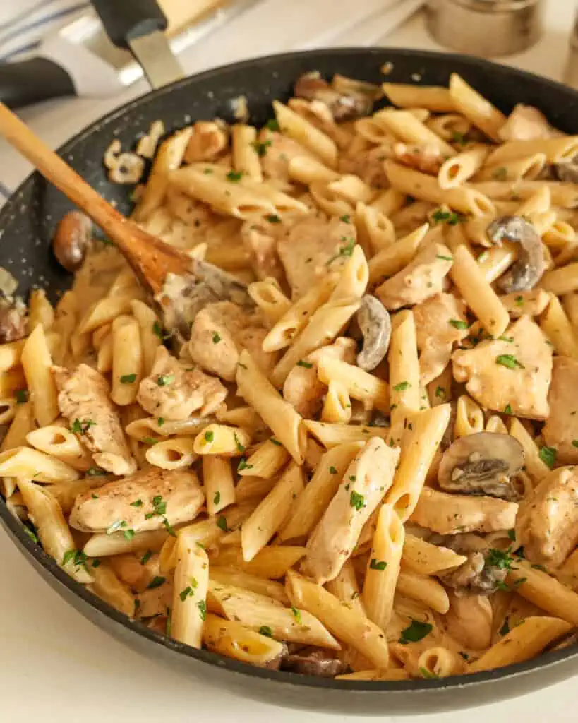 Creamy Chicken Mushroom Pasta combines garlic, onions, mushrooms, and chicken in a perfectly seasoned Parmesan cream sauce that comes together quickly and easily.