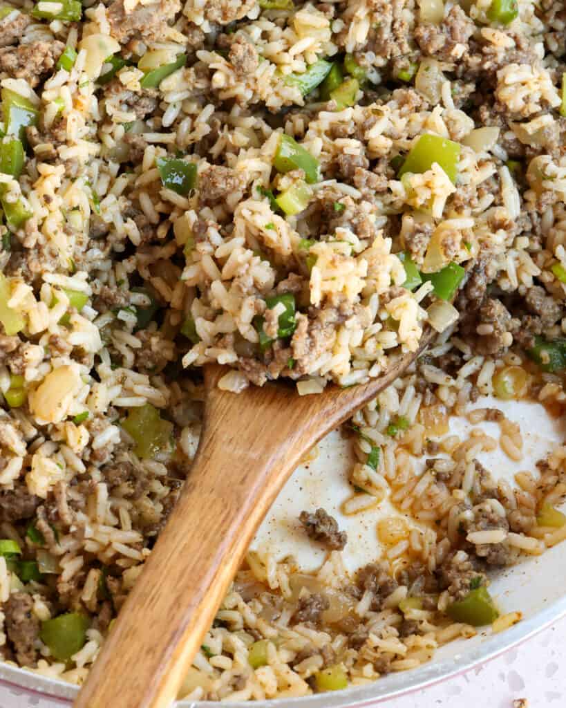 A large skillet full of dirty rice. 