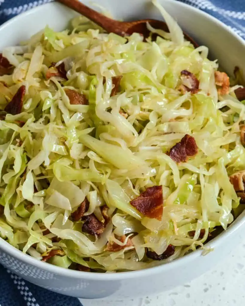 The Best Fried Cabbage Recipe is a simple six-ingredient recipe that combines cabbage, onions, and bacon cooked in butter and bacon drippings. 