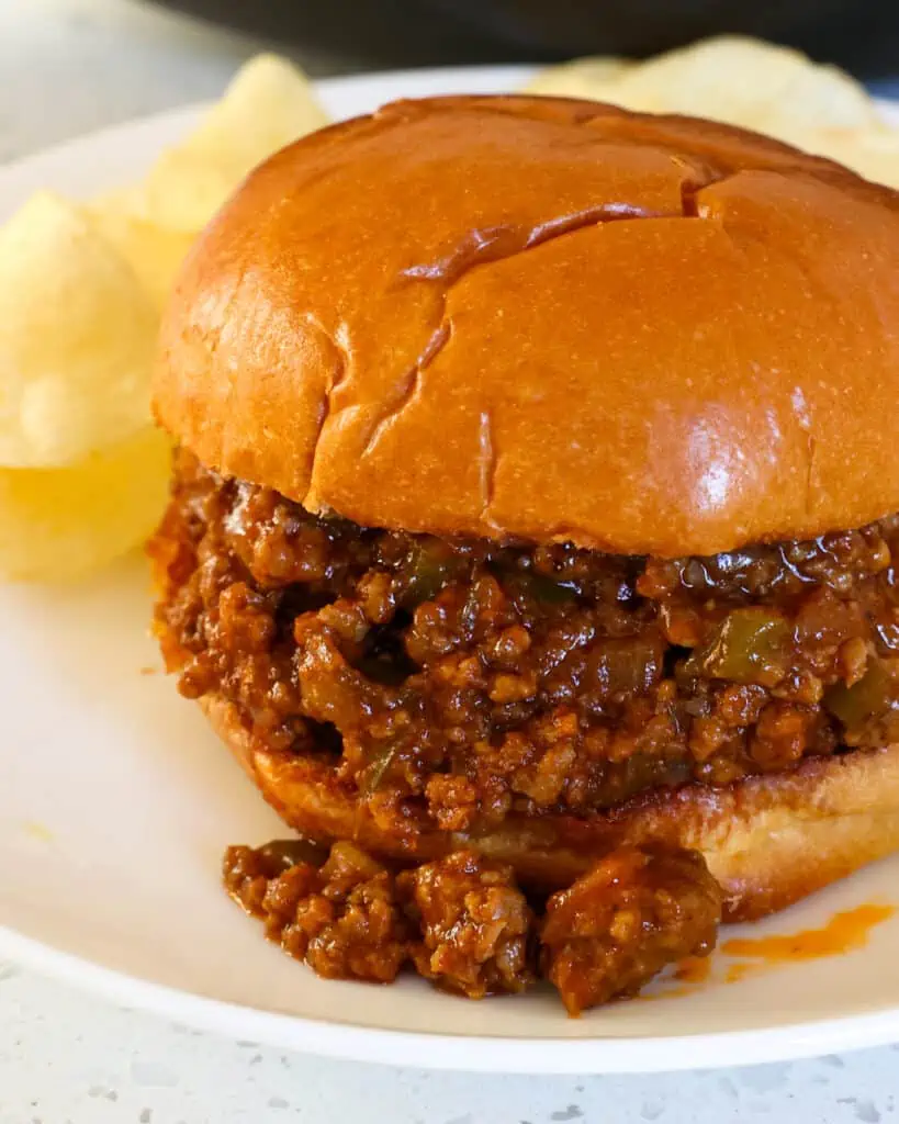 These sloppy joes are one of our favorite family recipes and is perfect for busy weeknights. It is full of flavor from onions, bell pepper, garlic, and brown sugar in a tomato-based sauce.