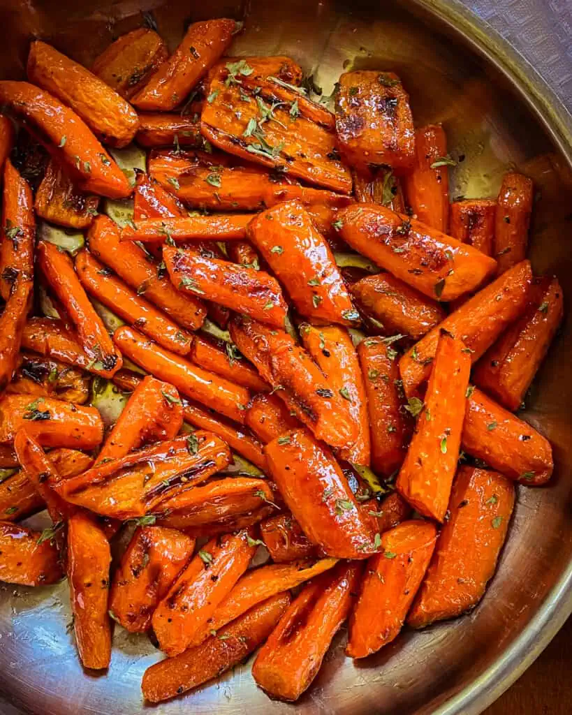 A simple and delicious Honey Roasted Carrots recipe with just eight easy ingredients.  They are the perfect side for roasted turkey, baked ham, grilled chicken, or roast beef.  
