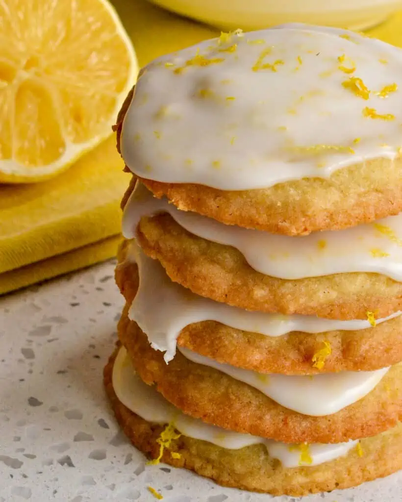 Family friendly Iced Lemon Cookies are soft on the inside with slightly crispy edges all topped with a sweet lemon glaze.