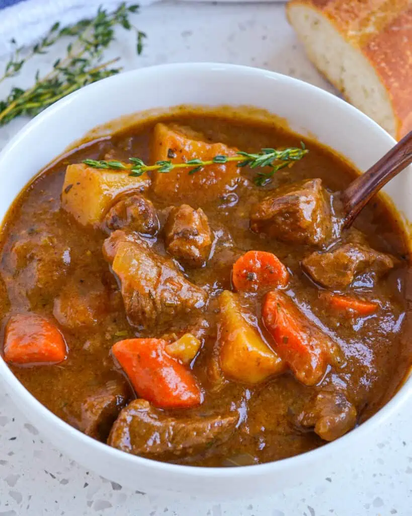 This mouthwatering good Irish Stew is made with tender chuck roast, carrots, onions, and potatoes in a flavorful beef gravy seasoned with rosemary and fresh thyme.