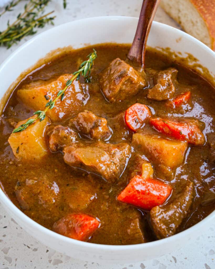 Warm up with this traditional beef Irish stew recipe, made with tender beef, hearty vegetables, and savory herbs and spices.