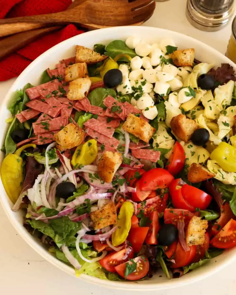 This light-yet-filling chopped Italian salad is packed with all the best things about Spring: fresh veggies, mozzarella cheese, crispy croutons, and a fresh homemade Italian dressing.