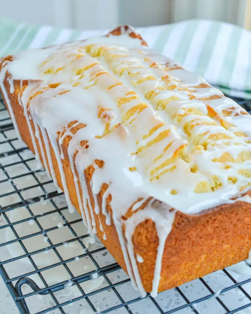 A whole lemon pound cake with a lemon drizzle. 