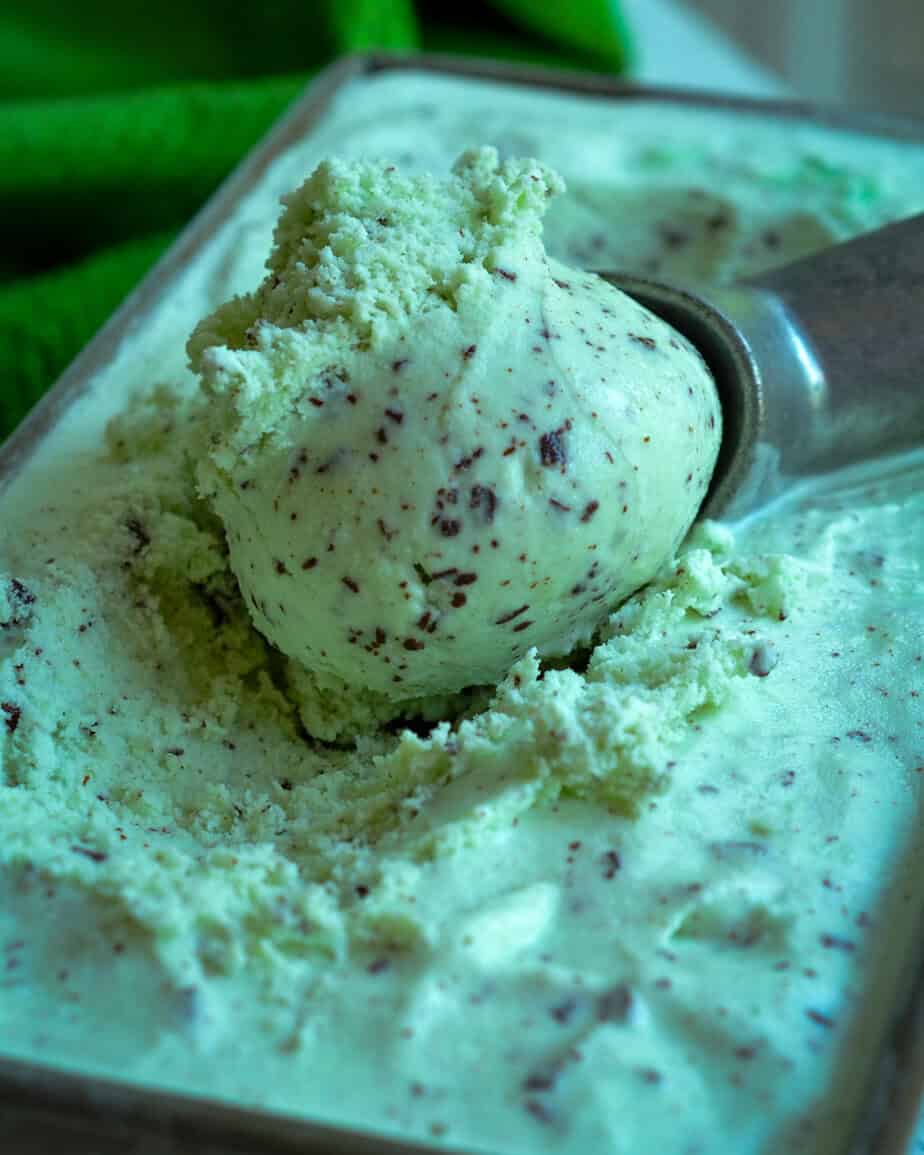 A loaf pan full of mint chocolate chip ice cream