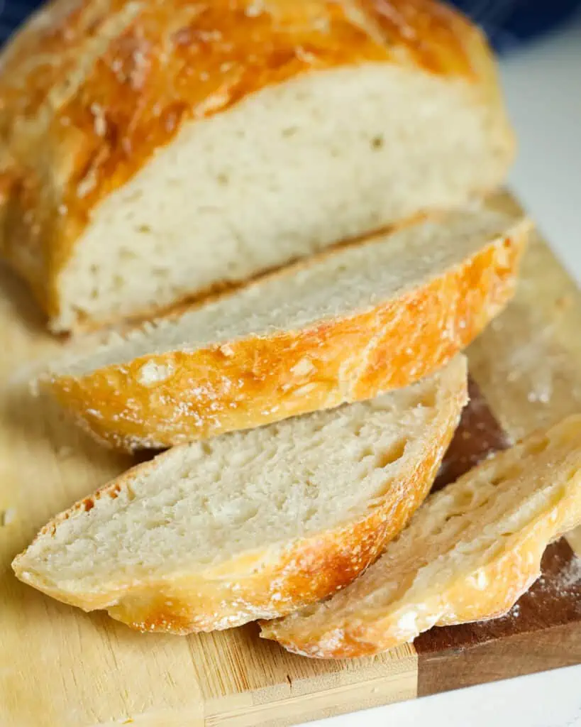 Let the bread cool for at least 1 hour before slicing. Warm bread is very tempting, but your bread will taste better if you can wait.  