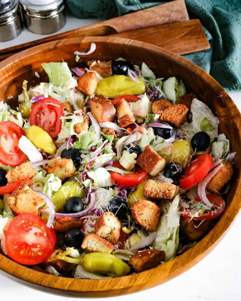 Learn how to recreate the famous Olive Garden salad at home, complete with their signature dressing. 