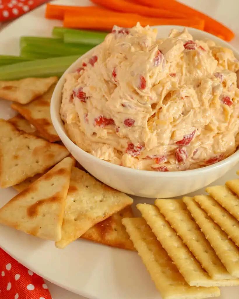 This classic Southern Pimento Cheese is sure to be the hit of your next party.  To take it over the top, serve in little steamed red potatoes.