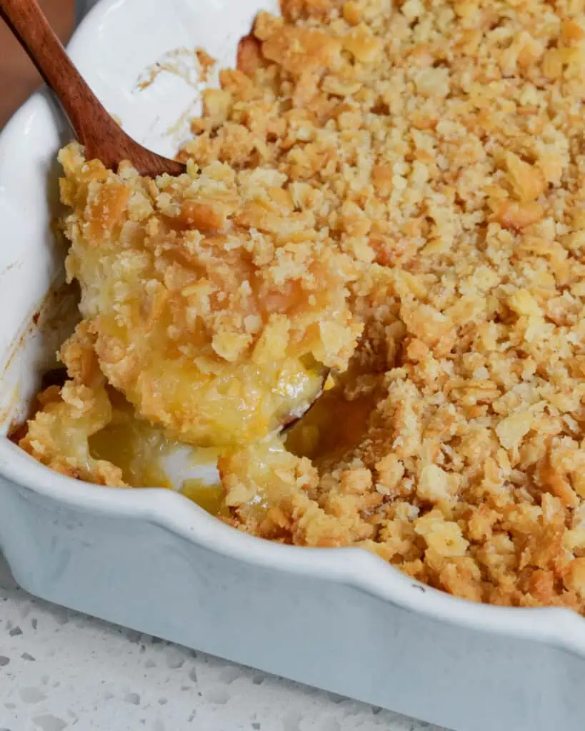 This highly popular southern Pineapple Casserole is made with sweet pineapple, tasty cheddar cheese, and buttery cracker crumbs. 