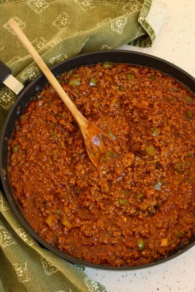 Simmer the meat mixture for about 20 minutes over low heat. Serve over any soft roll or, for a change of pace, serve over cooked rice, egg noodles, or homemade pizza dough for sloppy joe pizza. 