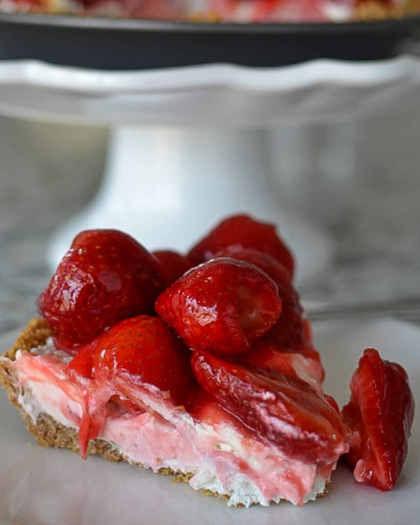 Strawberry Cream Cheese Pie This fresh Strawberry Cream Cheese Pie is a triple-layer delight starting with a three-ingredient graham cracker crust.
