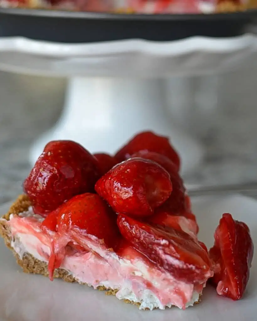 This fresh Strawberry Cream Cheese Pie is a triple-layer delight starting with a three-ingredient graham cracker crust.