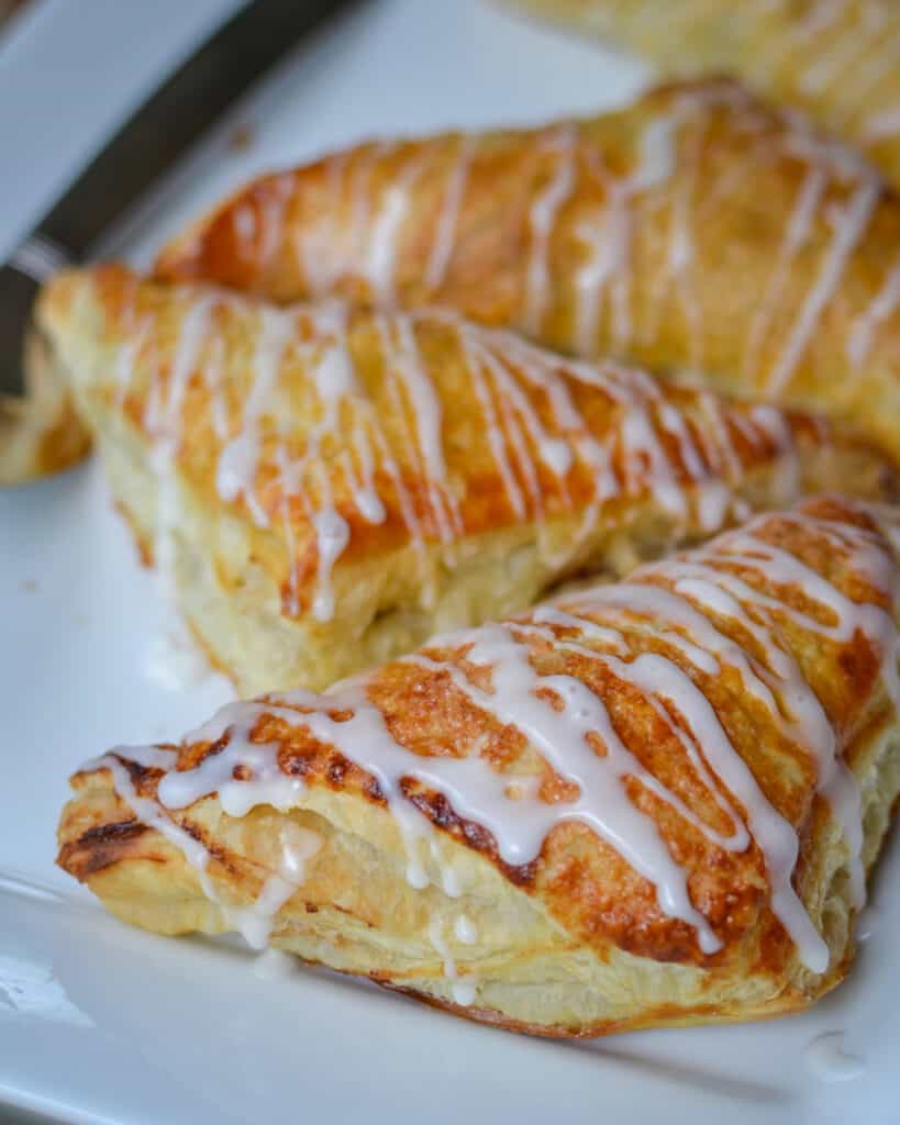 Whisk milk and powdered sugar together. Drizzle over cooled turnovers.