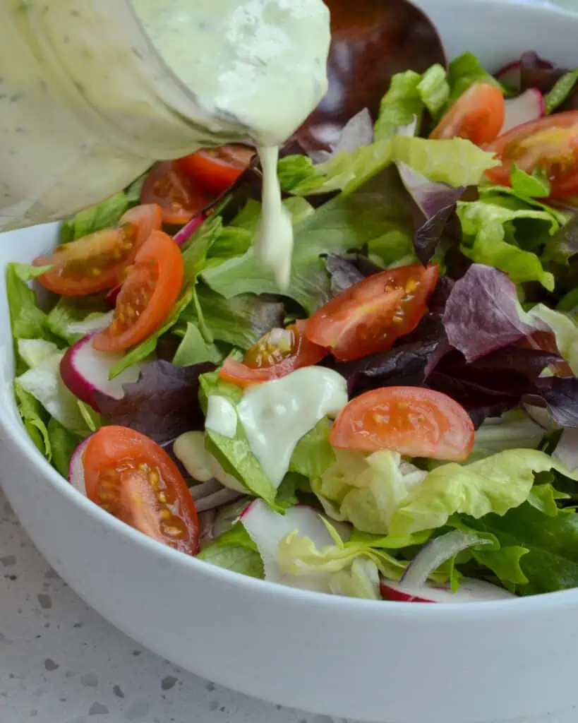 This flavor-packed homemade Avocado Ranch Dressing is made with fresh or dried herbs in less than ten minutes. Whip up a batch today and tantalize your taste buds.