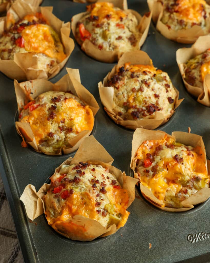These delectable Breakfast Muffins are loaded with pork sausage, sweet red bell peppers, green chiles, and sharp cheddar. 