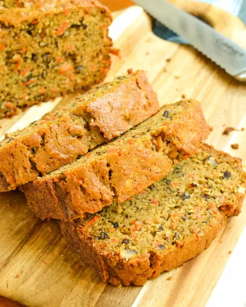 This scrumptious and moist Carrot Bread combines freshly grated carrots, shredded apple, chopped pecans, cinnamon, ginger, and nutmeg into the best carrot loaf you will ever have. 