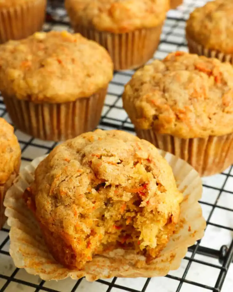 These moist Carrot Muffins bake up perfectly every time with plenty of freshly grated carrots, pineapple, and walnuts