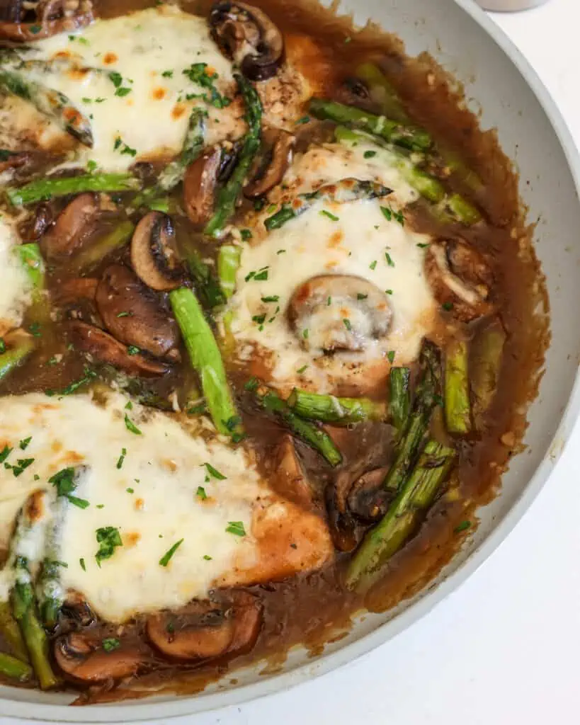 Chicken Madeira combines tender chicken, crisp asparagus, and melty mozzarella cheese in a sweet and savory wine sauce.