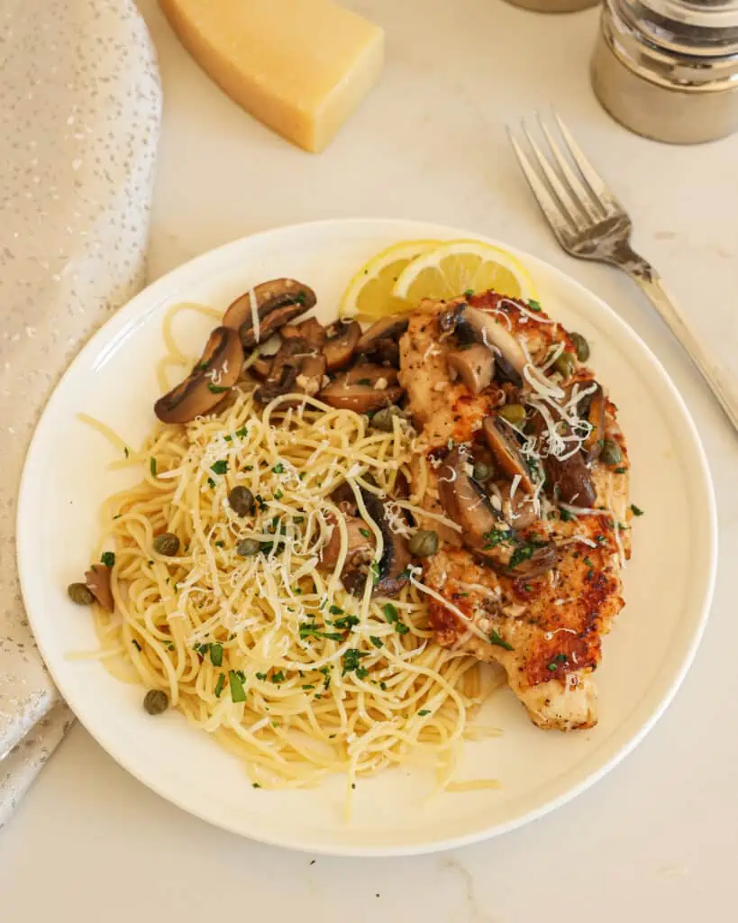 Chicken Scallopini is one of my absolute favorite recipes! I'm not sure if it is the lightly breaded golden brown chicken, the garlic lemon white wine sauce, or the salty capers, but I just adore it! 
