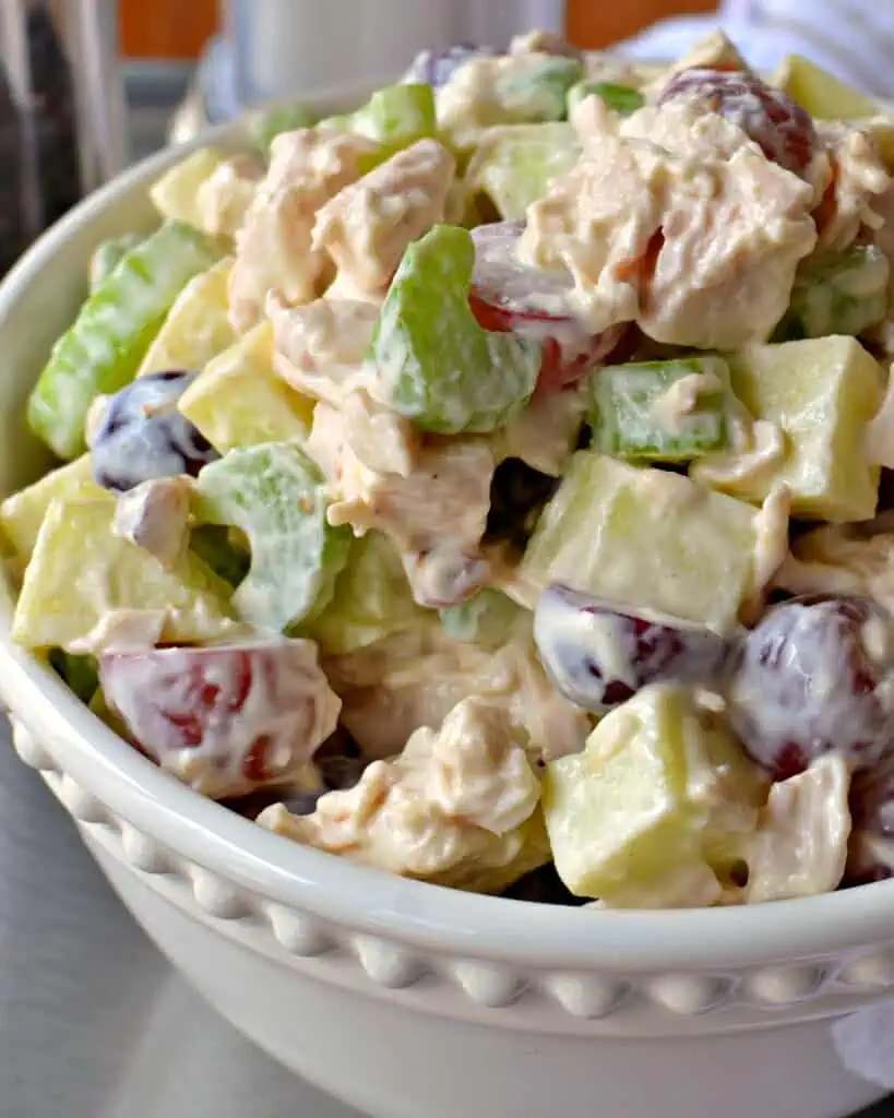 Chicken Waldorf Salad is tender chunks of chicken mixed with celery, grapes, apples, toasted walnuts, and mayonnaise.