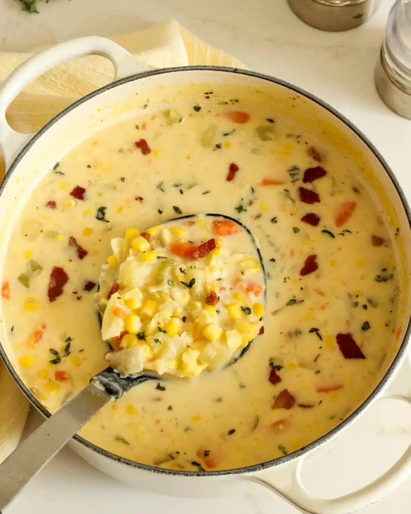 This corn chowder combines fresh sweet corn, onion, celery, carrots, tender chunks of potato, and crispy bacon in a creamy chicken broth base that is lightly seasoned and flavorful.