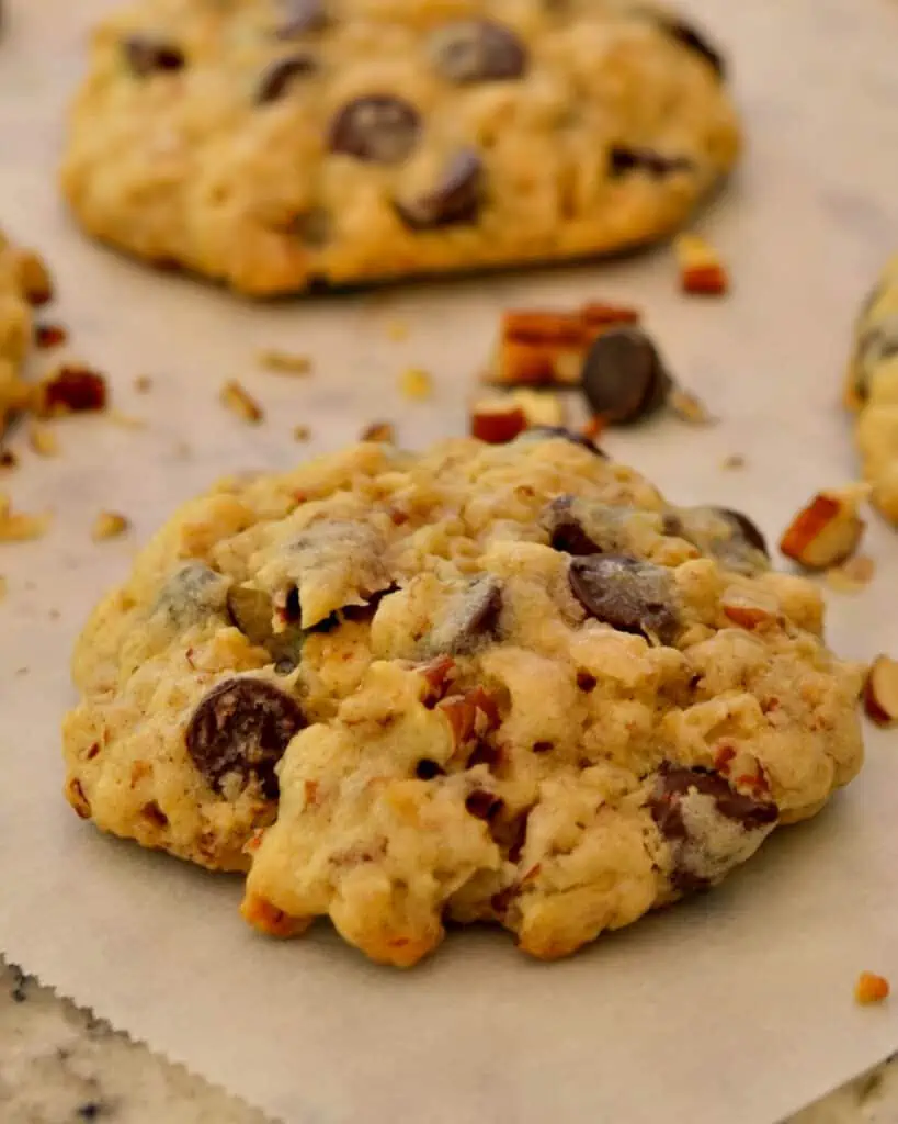 Cowboy cookies in a single layer on parchment paper. 