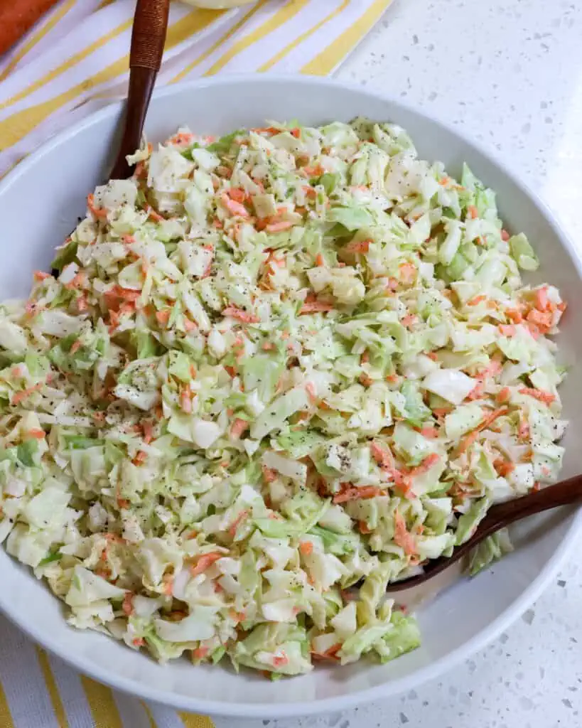 This will quickly become your new favorite creamy coleslaw recipe. It is made easily with simple ingredients, and it is creamier than KFC coleslaw. 