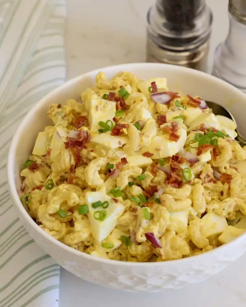 Learn how to make this delicious and unique pasta salad, which combines the flavors of deviled eggs, bacon, and pasta into one tasty salad. 
