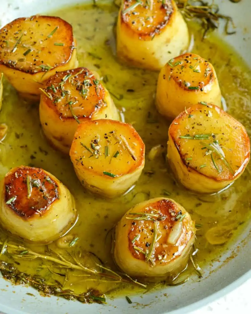 Easy yet elegant French Fondant Potatoes are tender baked with crispy edges in a buttery stock mixture with fresh herbs. 