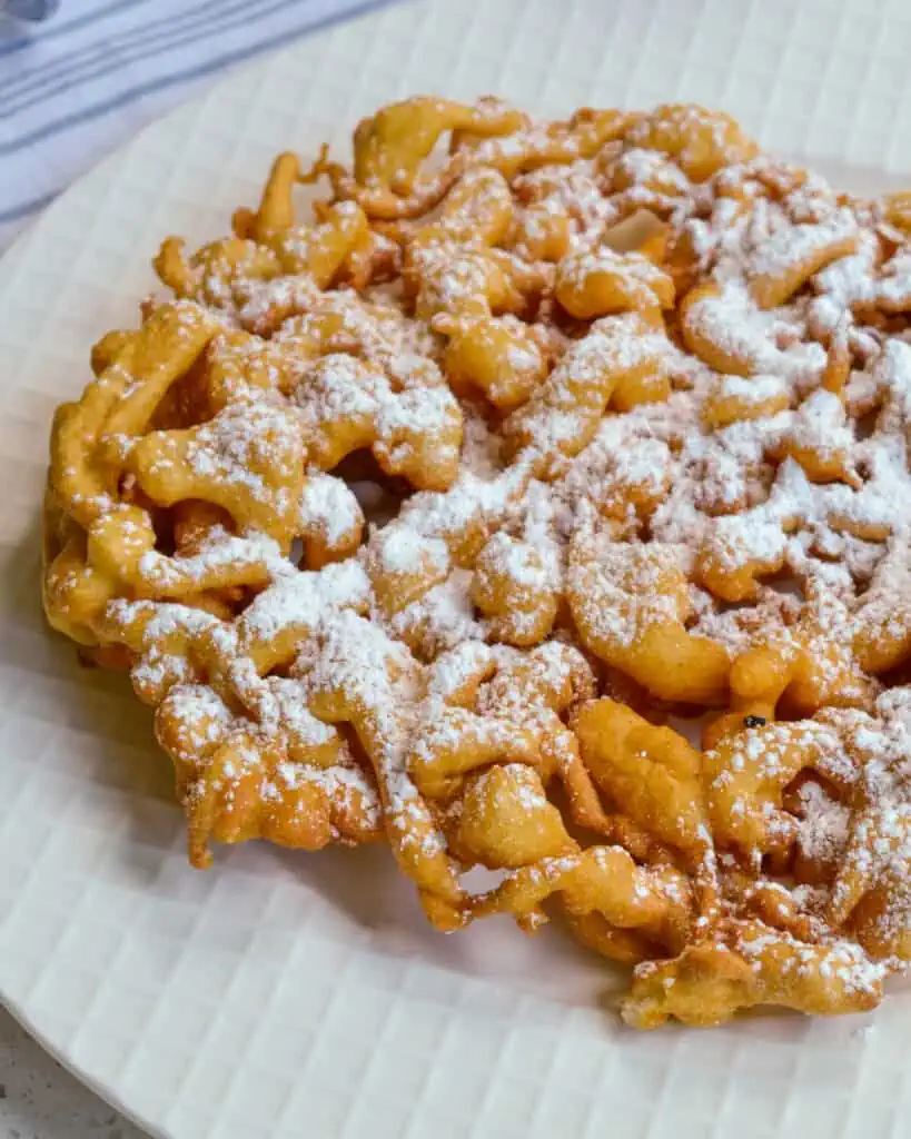 These scrumptious Funnel Cakes are so easy to make. You can bring the carnival home to your kitchen anytime. 