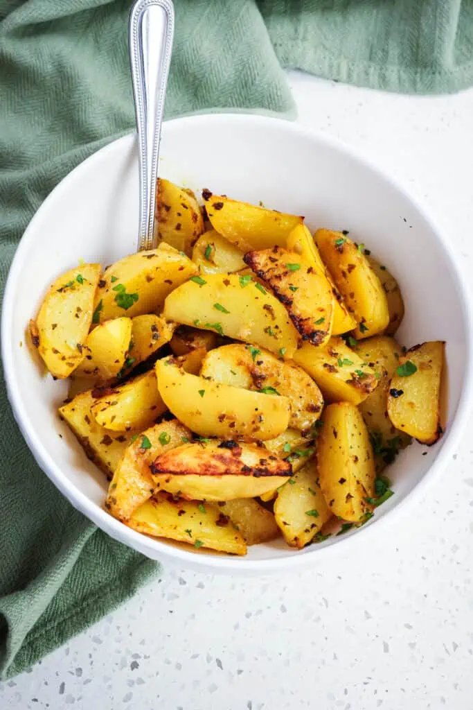 These Greek Lemon Potatoes are slathered in a tasty lemon garlic sauce with a touch of mustard and then roasted to perfection. 