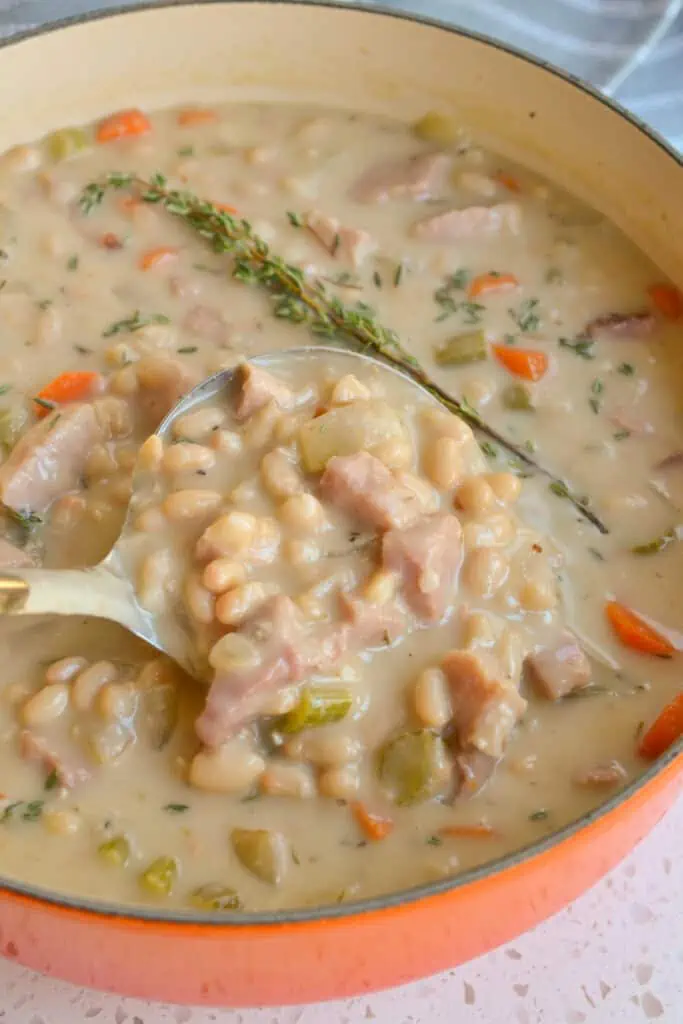 This simple yet delicious Ham and Bean Soup is made using a bone-in-ham steak, onion, celery, carrots, garlic, canned white beans, and a handful of common pantry spices