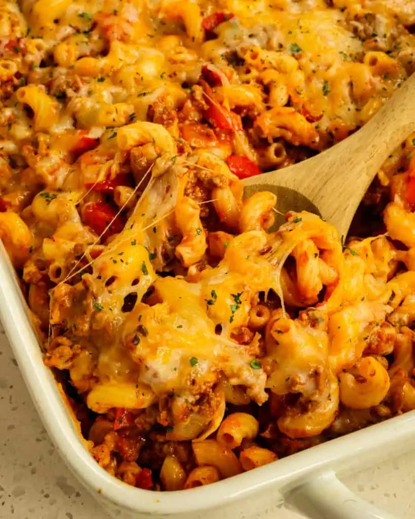 A large casserole dish full of cheesy hamburger casserole. 