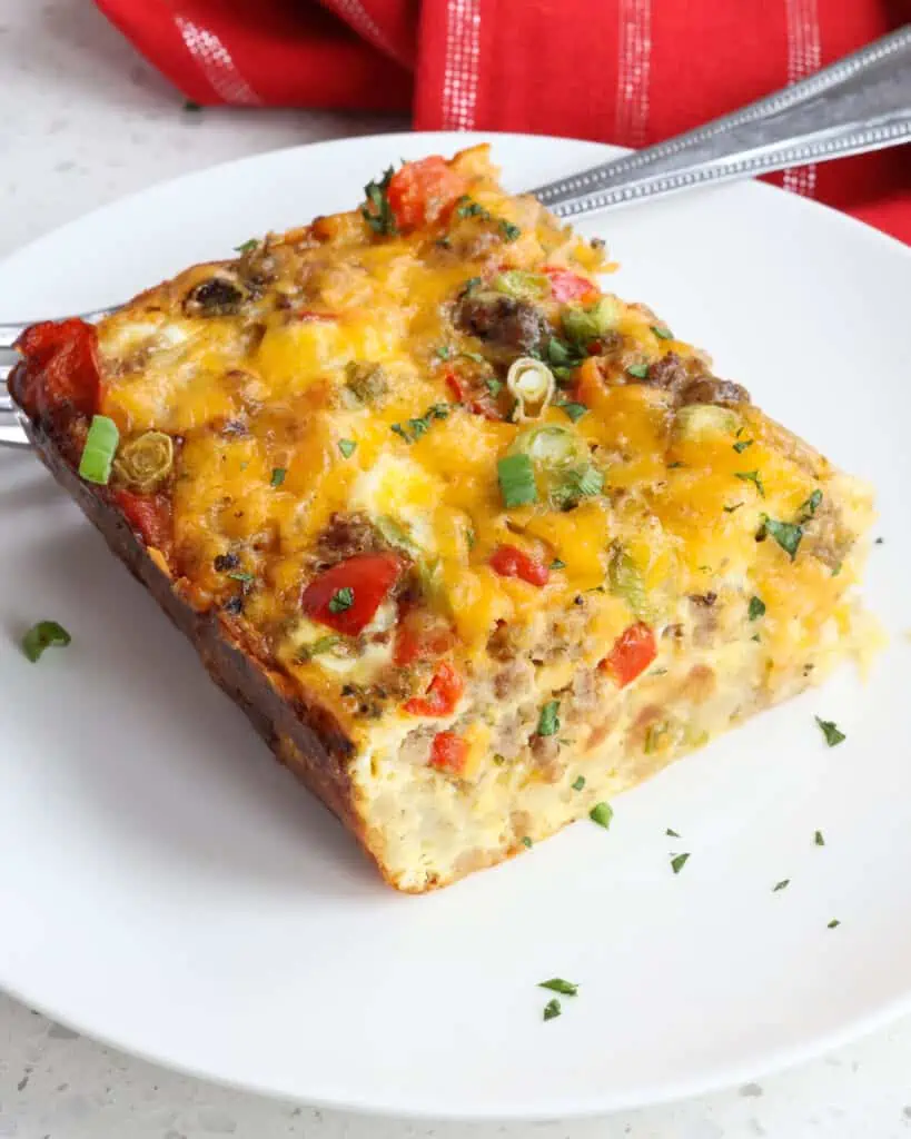 A super easy make-ahead and freezer-friendly Hashbrown Breakfast Casserole that is totally customizable to suit your taste with different breakfast meats like sausage, bacon, or ham, different vegetables, and a variety of cheeses.  
