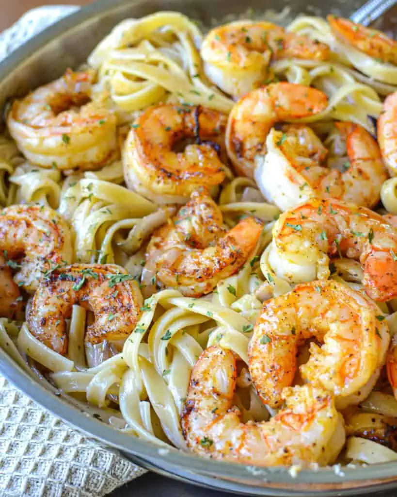 Cajun Shrimp Pasta is fettuccine and fresh shrimp in a delectable creamy creole seasoned sauce.