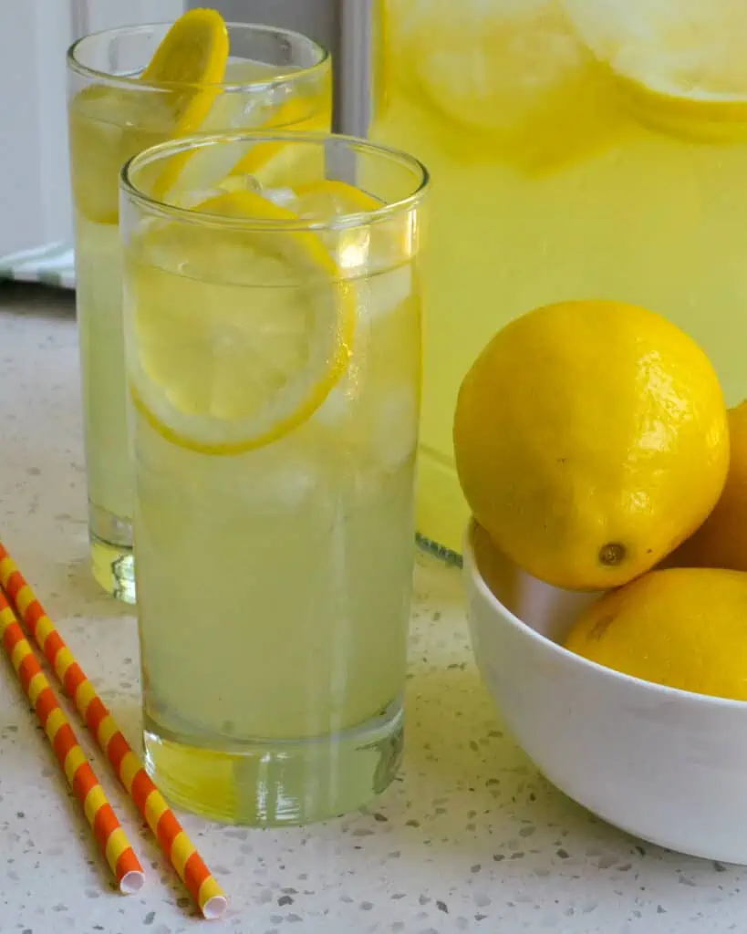 This Homemade Lemonade is the perfect balance of sweet and tart.  Make a batch of this refreshing ice-cold lemonade today.